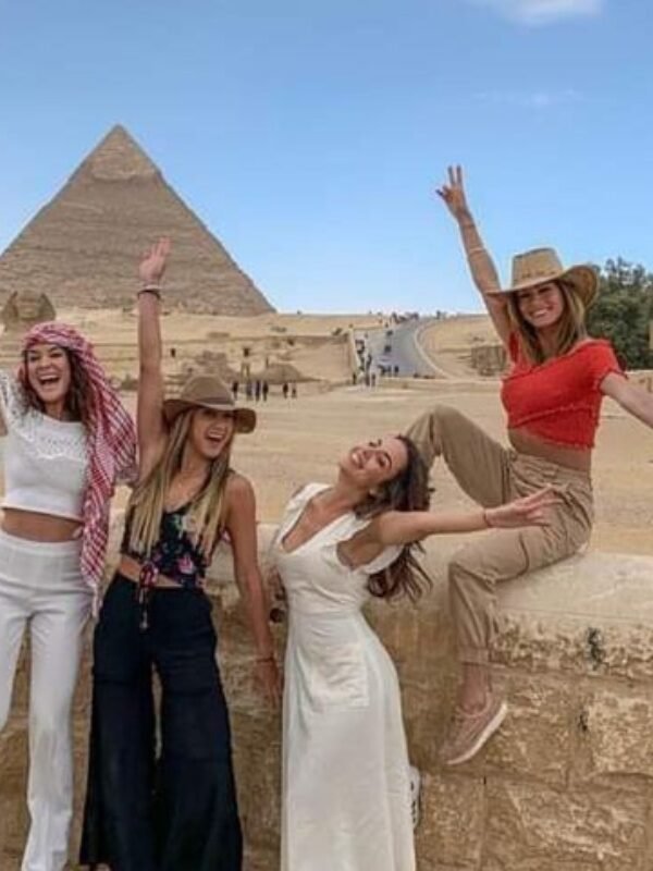 Happy travellers visiting the pyramids from Marsa Alam
