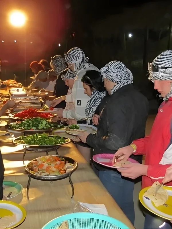 Family enjoying the dinner in desert safari tour from Marsa Alam