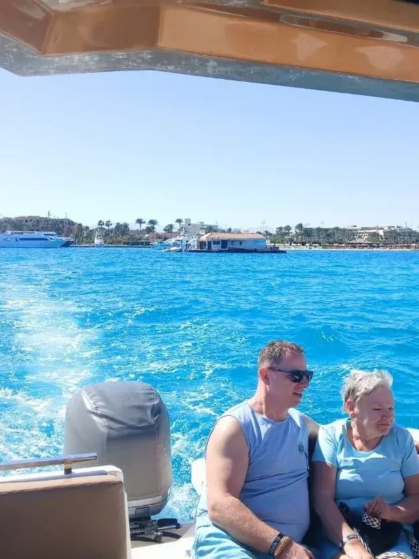 Family watching the dolphin on a Hurghada speed boat trip